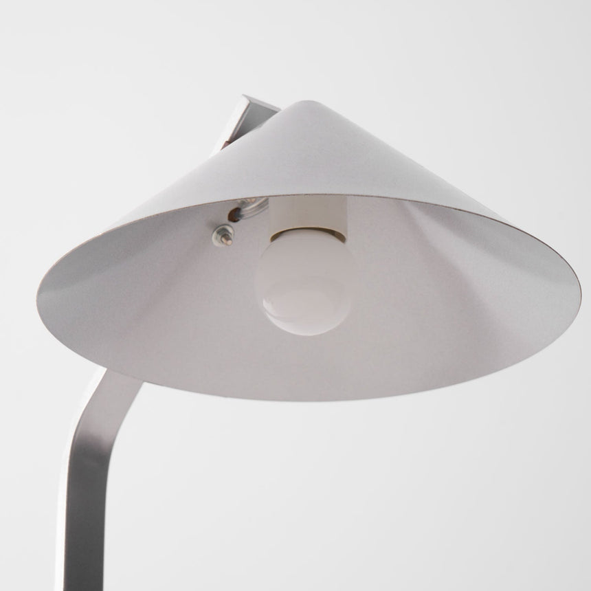 The open underside of the cone shade with the socket in view