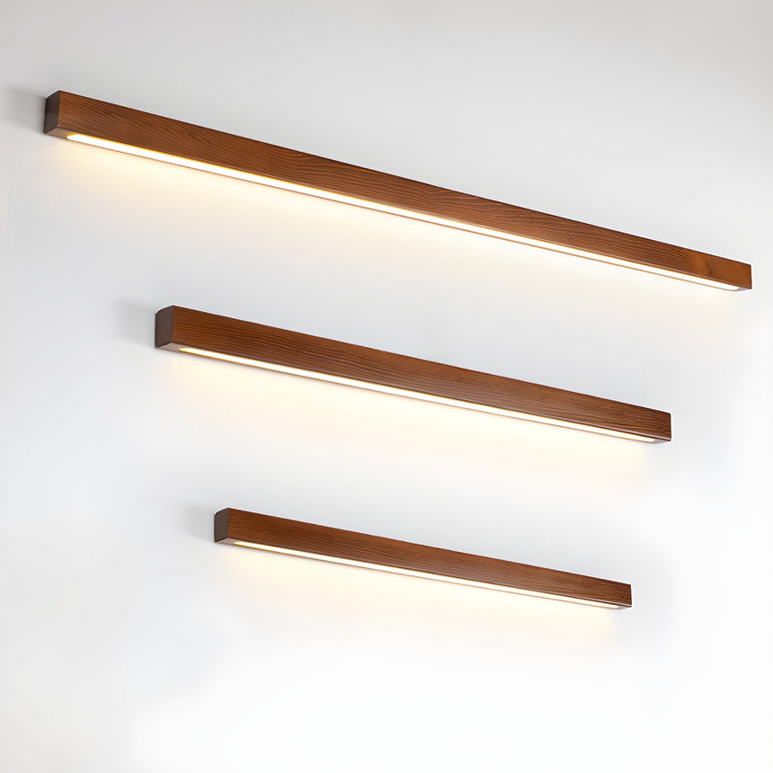 The three walnut bar lengths lit and stacked one above the other