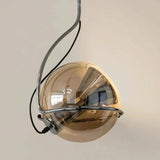 Close view of the half mirrored globe turned inside its metal ring