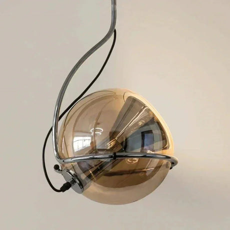 Close view of the half mirrored globe turned inside its metal ring