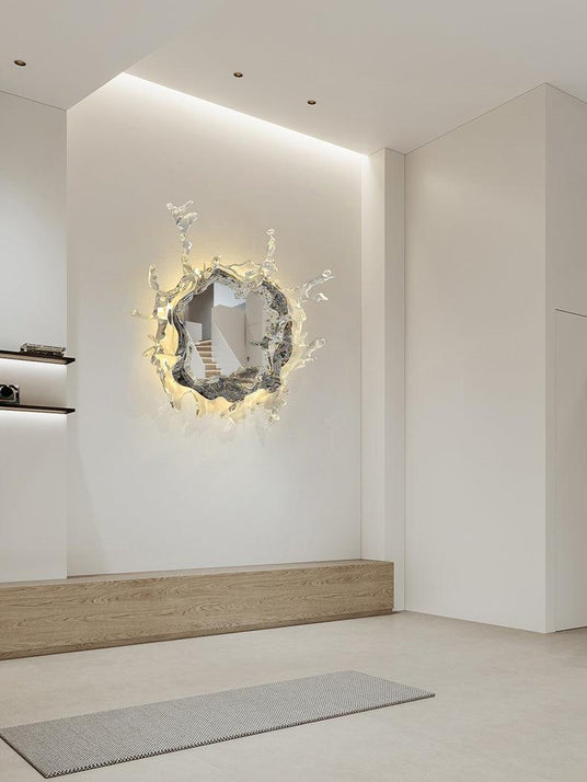 The mirrored light lit in a bright hallway above a wood bench