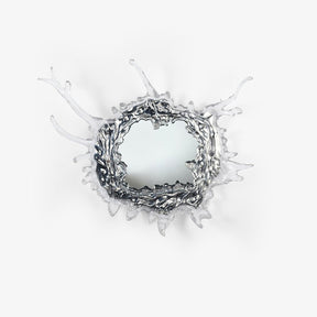 Round mirror wall light framed by a sculpted splash of clear drops in a chrome finish