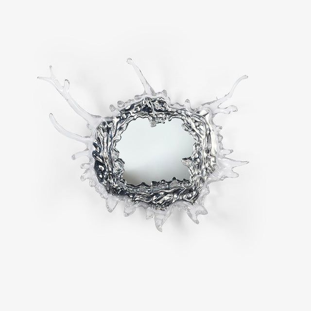 Round mirror wall light framed by a sculpted splash of clear drops in a chrome finish