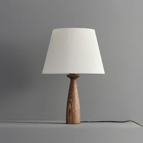 Ribbed shade lamp unlit against a gray ground, the grain clearly visible