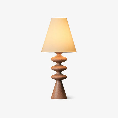 Table lamp with a rippled turned wood base and a cream cone shade