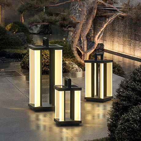 Four lanterns lit on paving in a garden with a pine and clipped shrubs