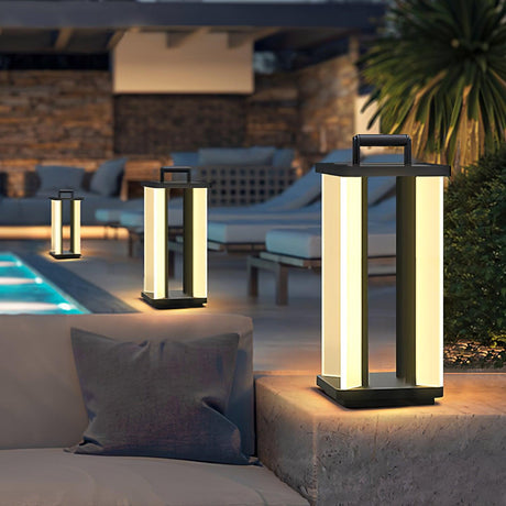 Lanterns lit on paving beside a lit pool with a cushion in the foreground