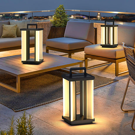 Lanterns lit on a roof terrace beside a timber table and low chairs