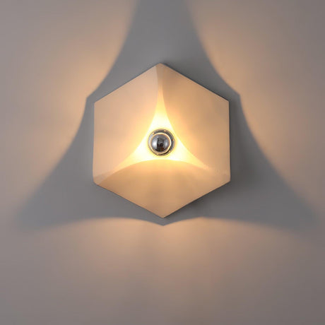 The white light lit, soft light spreading from its folded edges