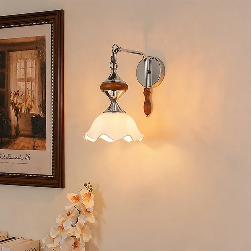 The white ruffled version lit beside a framed painting and orchids