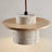Travertine chandelier installed above dining table