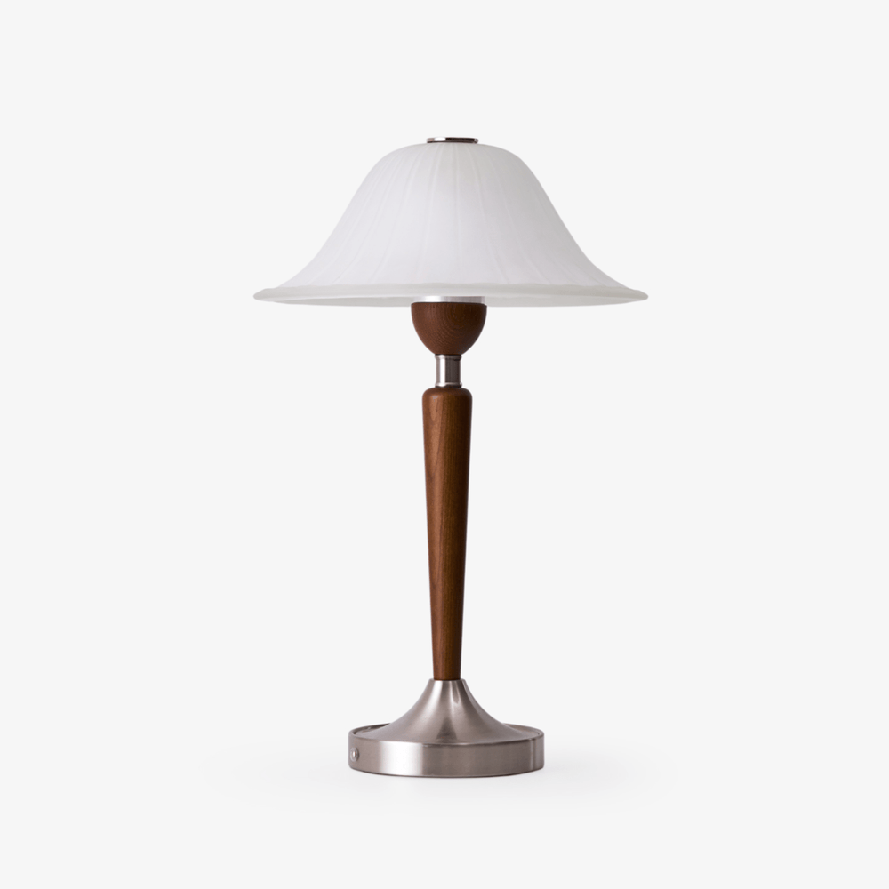 Nightstand table lamp with a frosted glass bell shade on a walnut stem, plain ground