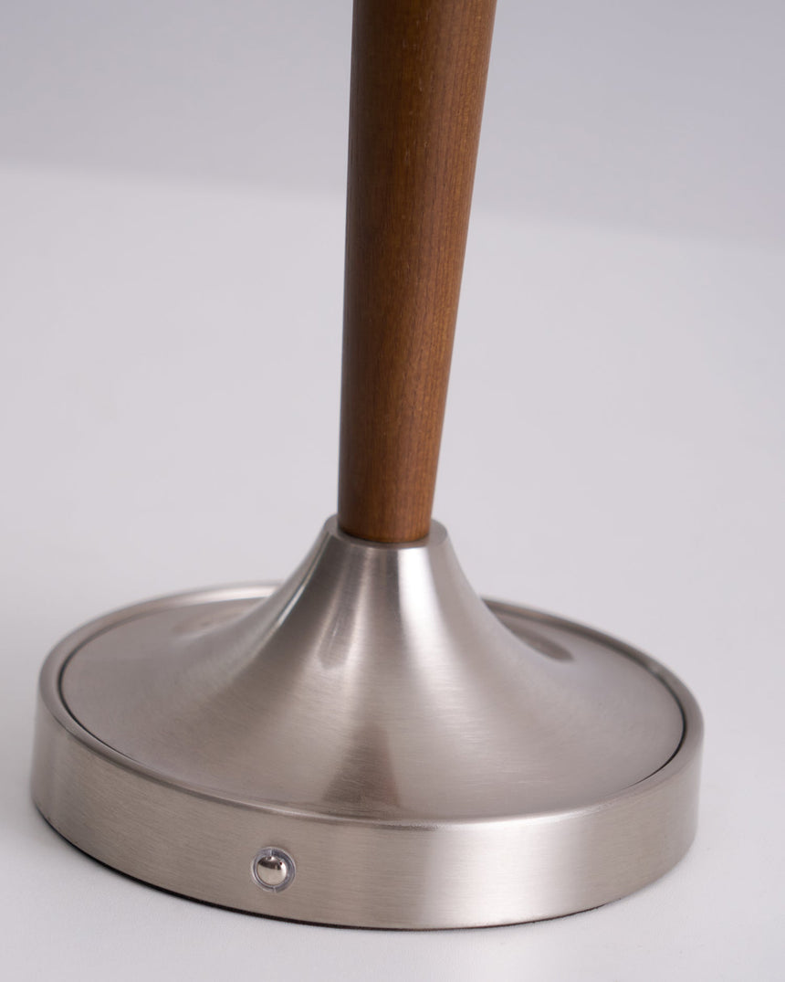Close view of the brushed nickel foot and the touch point on its edge