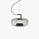 Wide green glass shade seen from the side against white