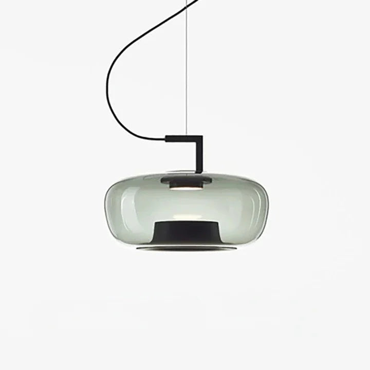 Wide green glass shade seen from the side against white