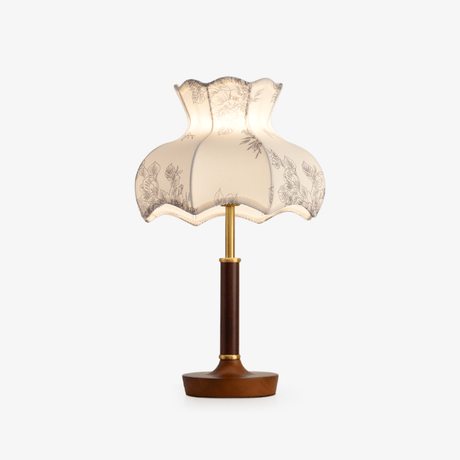 Table lamp with a scalloped blossom shade printed in gray on white