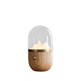 Nursery table lamp with a light wood base, plain background