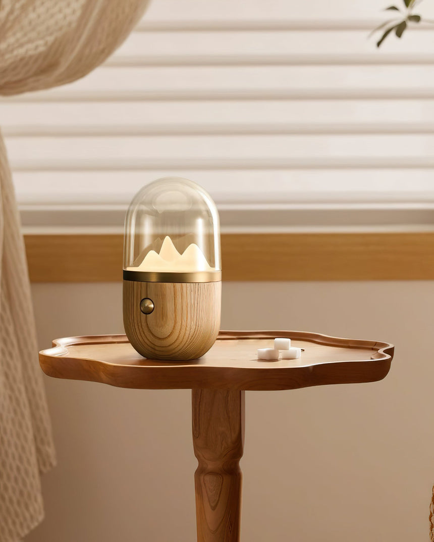 Nursery table lamp lit on a small wooden side table by a window