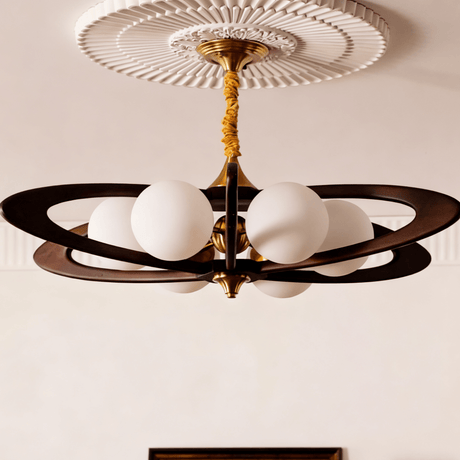 White opal globes lit close, the dark rings crossing behind them