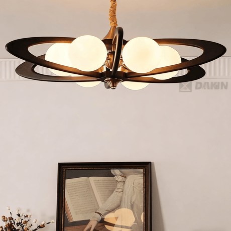 The crossed wood rings seen angled with the globes lit between them