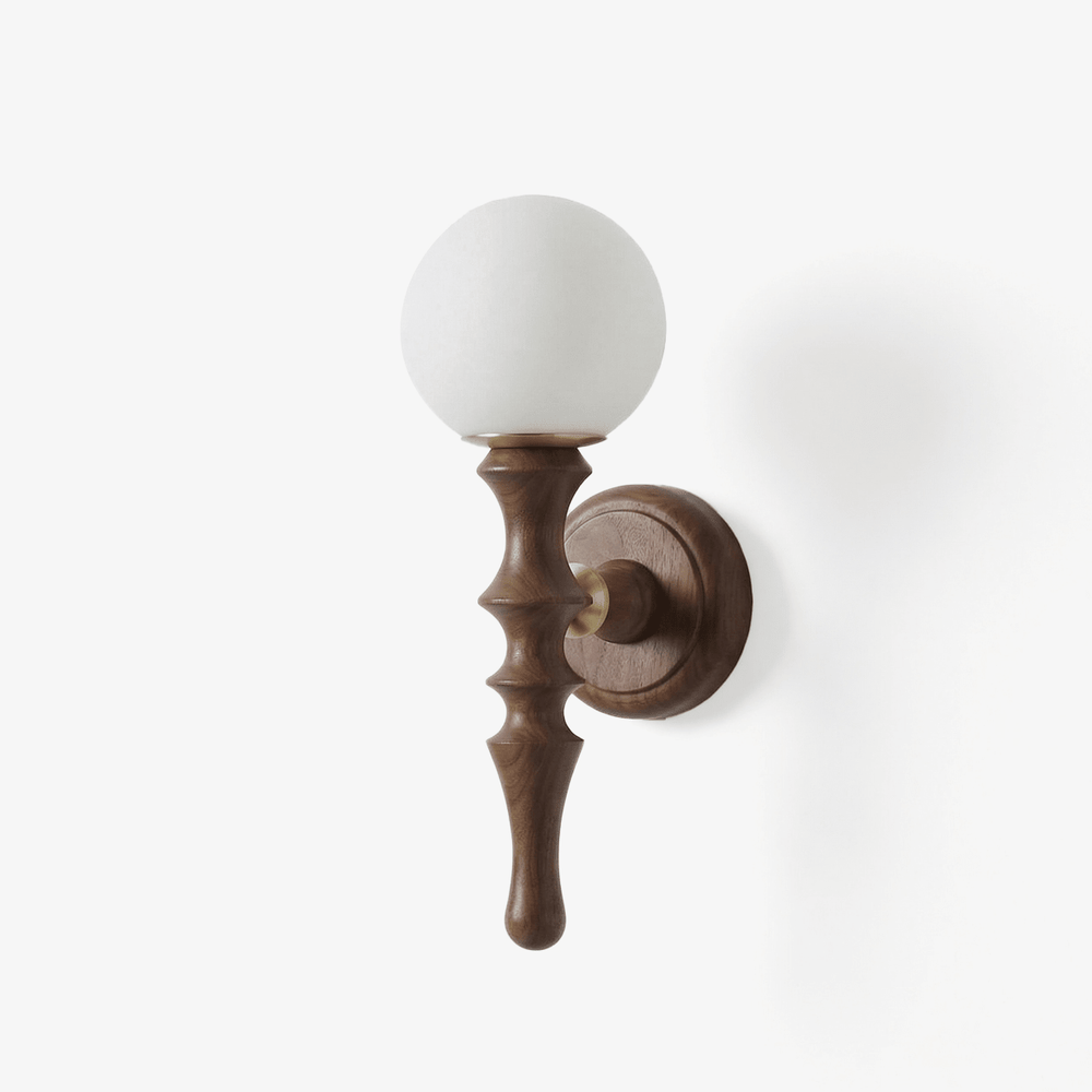 Orb wall sconce, a turned wood stem on a round plate carrying a white orb