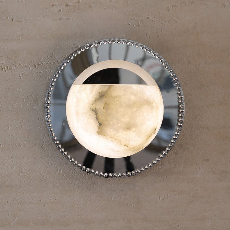 Front view of the lit alabaster bowl inside the mirrored ring