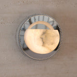 The alabaster bowl lit warm, its natural veining visible