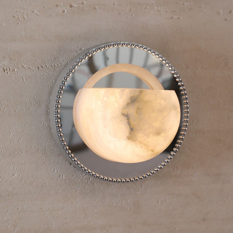 The alabaster bowl lit warm, its natural veining visible