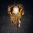 A flowing sculptural form built from dozens of amber acrylic layers around a core