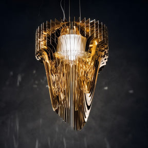 A flowing sculptural form built from dozens of amber acrylic layers around a core