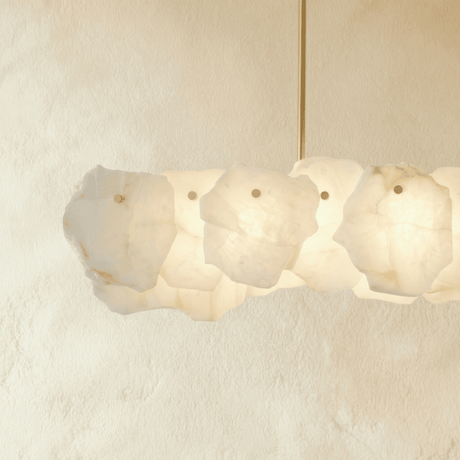 A bar of overlapping stone petals seen straight on, lit