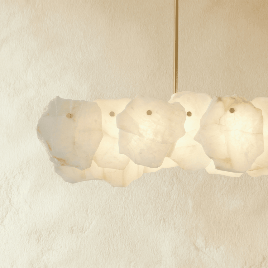 A bar of overlapping stone petals seen straight on, lit