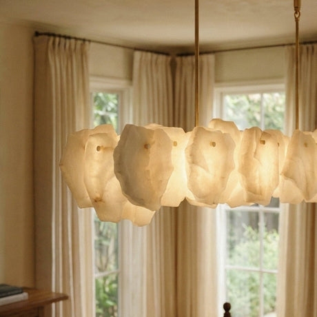 A lit petal bar in front of a window with curtains and a chair