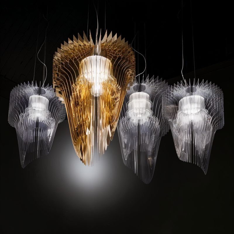 Four of the fittings hung together, clear and amber layers lit side by side