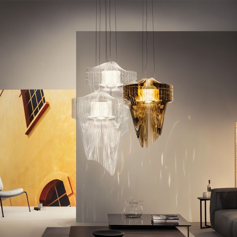 Three of the fittings lit above a living room sofa, a low table and artwork