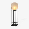 Opal cylinder shade resting in an open square steel stand in black