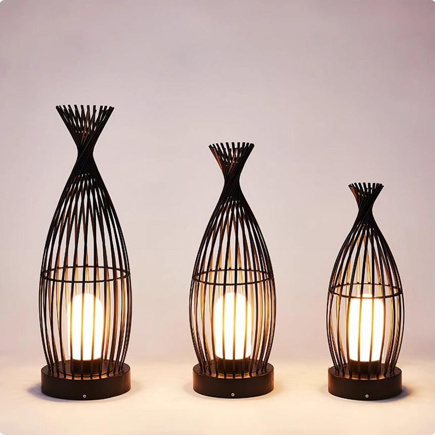 The three sizes lit together against a warm pale studio background