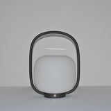The arch standing clear above the globe, the touch switch on the base