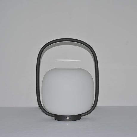 The arch standing clear above the globe, the touch switch on the base