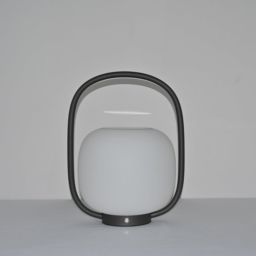 The arch standing clear above the globe, the touch switch on the base