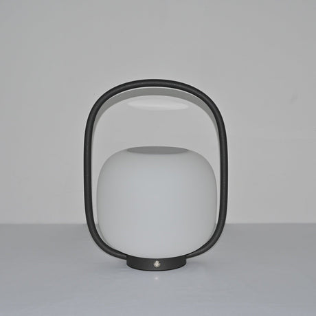 The lamp unlit, the matte globe and the arch handle seen in daylight