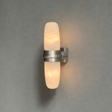 The brushed nickel version with its lit tube on a gray background