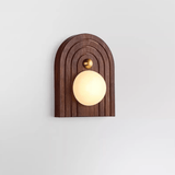 The walnut arch version with a glowing sphere sitting low in the opening