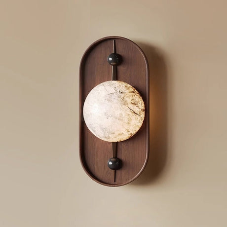 Close view of the lit stone look disc where the two pins hold it