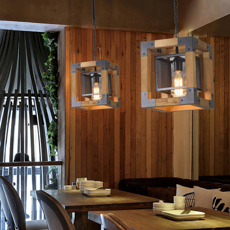 Two of the small cube version lit above tables in a timber lined room