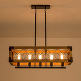 The long frame lit warm, the crossed braces reading against the lamps