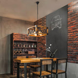 Lit above a bar table in a room with wine shelving and a brick wall