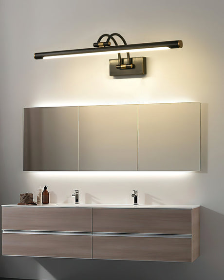 Dark bronze bar lit along a wide mirror above a double basin wood vanity unit