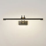 Dark bronze bar lit on a pale wall, the glow spreading down and out from the tube