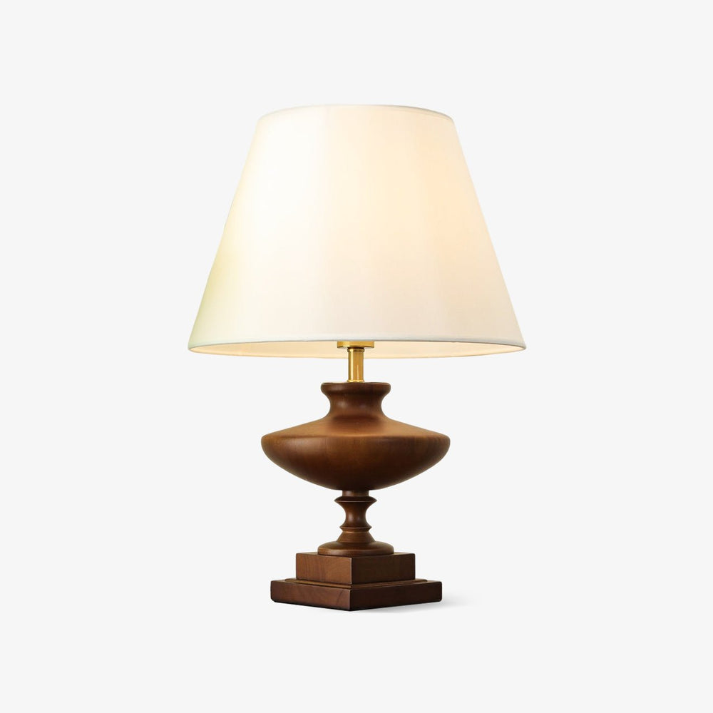 Oversized table lamp with a white shade on a walnut urn base, plain background